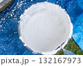 Mixing white plaster powder in construction bucket for renovation 132167973