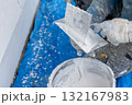 Construction worker plastering wall during house renovation 132167983