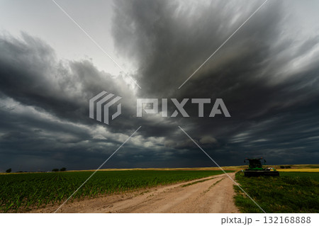 Black Clouds Stretch Endlessly Across the Sky Over Remote Farmland 132168888
