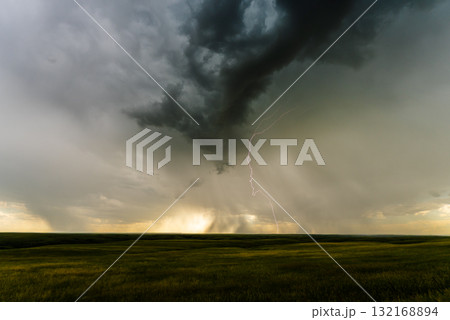 Dark clouds developing lightning strike overhead dramatic view Dark clouds developing lightning strike overhead dramatic view 132168894