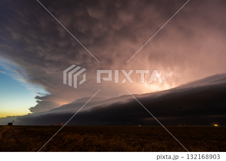 Lightning flickering through approaching storm clouds Lightning flickering through approaching storm clouds 132168903