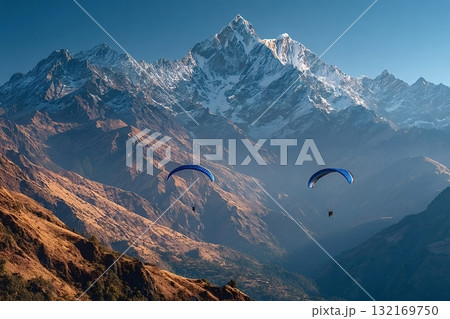 Paragliders flying over the annapurna range in nepal Paragliders flying over the annapurna range in nepal 132169750