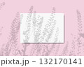 Natural light casts the shadow of field grass on a horizontal sheet of textured white paper on a pink table background. Mockup 132170141