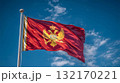 Somalias flag waving under a clear blue sky with fluffy white clouds on a sunny day 132170221