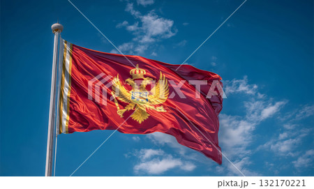 Somalias flag waving under a clear blue sky with fluffy white clouds on a sunny day 132170221