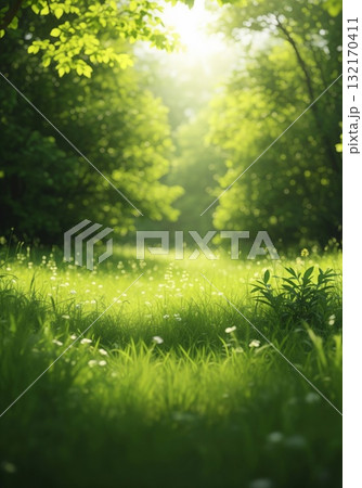 Lush Green Meadow with Sunlight Streaming Through Trees Vertical 132170411