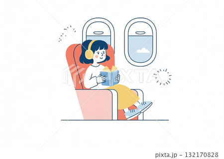 飛行機内で本を読んでリラックスする女性 132170828