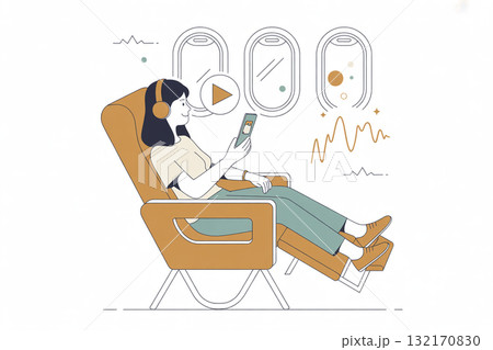 飛行機内で本を読んでリラックスする女性 132170830