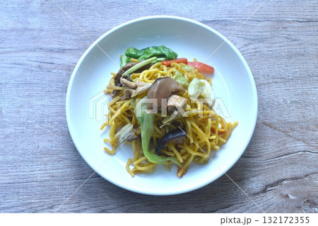 fried yakisoba noodles and cabbage with mushroom vegetarian food on plate fried yakisoba noodles and cabbage with mushroom vegetarian food on plate 132172355
