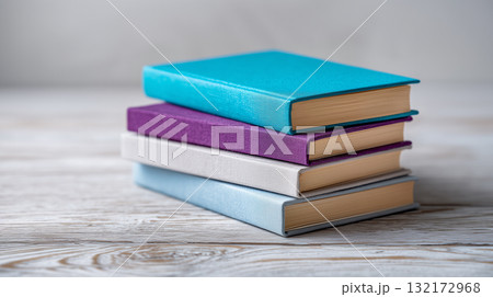 Minimal study scene with colorful clothbound books for learning and focus 132172968