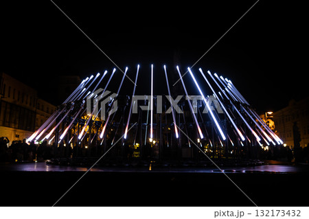 The fascinating night scene captures a modern light installation that dominates the space with a futuristic aesthetic and consists The fascinating night scene captures a modern light installation that dominates the space with a futuristic aesthetic and consists 132173432
