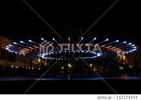 The fascinating night scene captures a modern light installation that dominates the space with a futuristic aesthetic and consists The fascinating night scene captures a modern light installation that dominates the space with a futuristic aesthetic and consists 132173433