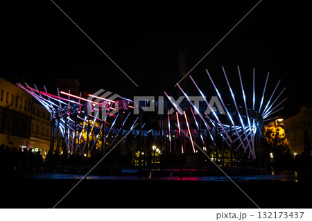 The fascinating night scene captures a modern light installation that dominates the space with a futuristic aesthetic and consists The fascinating night scene captures a modern light installation that dominates the space with a futuristic aesthetic and consists 132173437