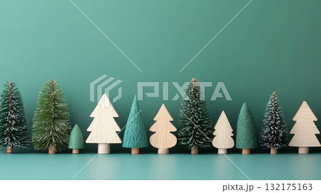Minimalist Christmas trees made of wood and felt on green background. Christmas decor and craftwork, eco friendly, sustainable concept. Minimalist Christmas trees made of wood and felt on green background. Christmas decor and craftwork, eco friendly, sustainable concept. 132175163