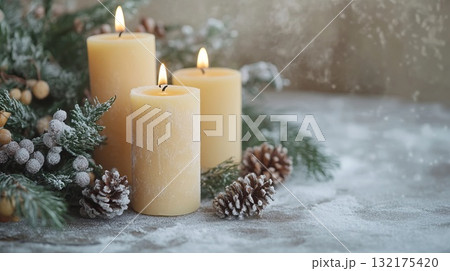 Three lit candles with winter decorations on snowy background. Christmas craft activity, creative DIY project for kids, decor and craftwork, eco friendly, sustainable concept. 132175420