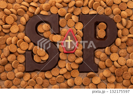 Background Dutch holiday Sinterklaas with copy space for text. Kruidnoten cookies and traditional hollands sweets. Background Dutch holiday Sinterklaas with copy space for text. Kruidnoten cookies and traditional hollands sweets. 132175597