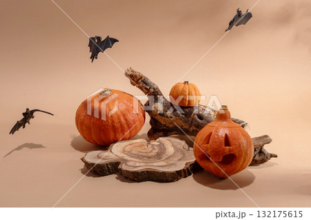 Empty wooden log on table with pumpkin and bats. Halloween or Thanksgiving mock up for products. 132175615