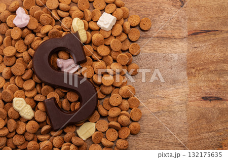 Background Dutch holiday Sinterklaas with copy space for text. Kruidnoten cookies and traditional hollands sweets. 132175635