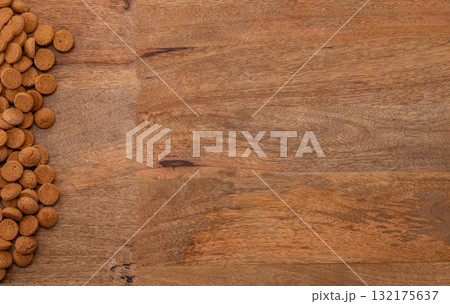 Background Dutch holiday Sinterklaas with copy space for text. Kruidnoten cookies and traditional hollands sweets. Background Dutch holiday Sinterklaas with copy space for text. Kruidnoten cookies and traditional hollands sweets. 132175637