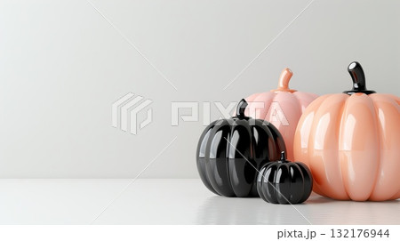 Shiny black and pastel-colored pumpkins on a smooth white surface. Minimalist style. Halloween and autumn decoration concept Shiny black and pastel-colored pumpkins on a smooth white surface. Minimalist style. Halloween and autumn decoration concept 132176944
