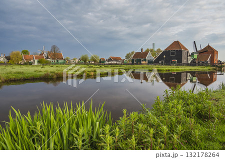 Dutch Windmill and traditional house at Zaanse Schans Village, Amsterdam Netherlands 132178264