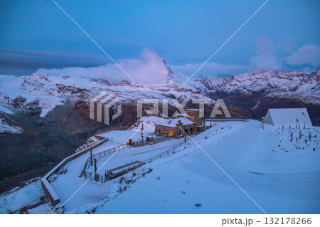 Zermatt Switzerland, view of Matterhorn mountain peak and Gornergrat bahn train in winter season Zermatt Switzerland, view of Matterhorn mountain peak and Gornergrat bahn train in winter season 132178266