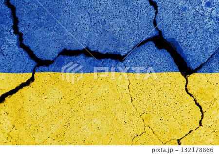 Cracked Ukrainian flag. Collapse of the country. 132178866