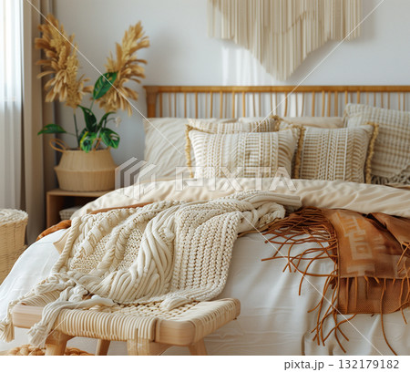 Cozy bedroom interior design with knitted blanket and wooden stool Cozy bedroom interior design with knitted blanket and wooden stool 132179182
