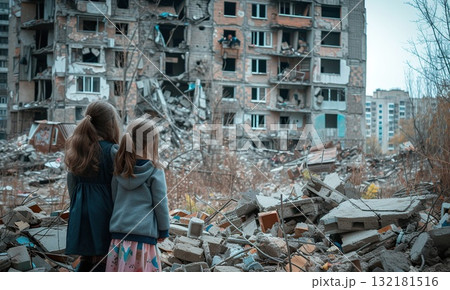 small kids standing in city destroyed by war, children in town demolished by earthquake, people and ruined buildings 132181516