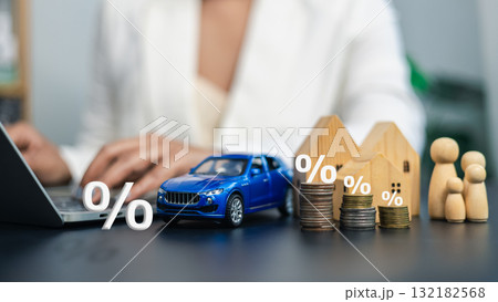 Interest Rate and Investment Concept with House, Car, Coins, and Family Model Interest Rate and Investment Concept with House, Car, Coins, and Family Model 132182568