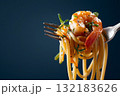 Hyperrealistic close up of a fork holding shrimp pasta with vibrant colors and textures 132183626