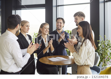 Business people clapping hands on meeting in office, celebrating success or making a deal. Business people clapping hands on meeting in office, celebrating success or making a deal. 132184078