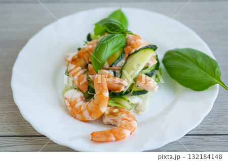 Juicy salad with seafood on a wooden table 132184148