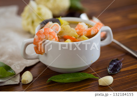 Tender Seafood Soup with Potatoes and Carrots 132184155