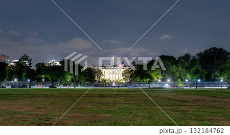 The White House, the official residence of the U.S. President, viewed from The Ellipse in Washington, D.C., United States. The historic neoclassical building is illuminated at night behind a security The White House, the official residence of the U.S. President, viewed from The Ellipse in Washington, D.C., United States. The historic neoclassical building is illuminated at night behind a security 132184762