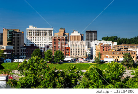 Downtown skyline of Charleston, West Virginia, United States, viewed from across the Kanawha River on a clear, sunny day. The cityscape features historic and modern architecture along the riverfront Downtown skyline of Charleston, West Virginia, United States, viewed from across the Kanawha River on a clear, sunny day. The cityscape features historic and modern architecture along the riverfront 132184800
