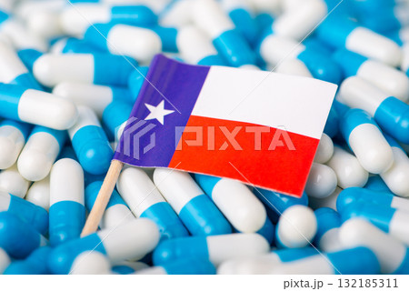Flag of Texas on pile of pills. Epidemic in the US state concept 132185311