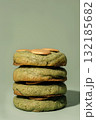 Stack of green cookies with golden topping on a soft background featuring copy space 132185682