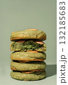 Stack of green cookies with creamy filling on a soft background featuring copy space 132185683