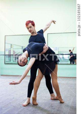 Pair of young beautiful dancers performing classical dance in studio. Learning choreography 132185887