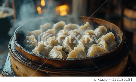 A close-up of delicious mandu being steamed in a bamboo basket A close-up of delicious mandu being steamed in a bamboo basket 132186181