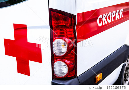 Ambulance car. Text in Russian: Emergency medical care Ambulance car. Text in Russian: Emergency medical care 132186576