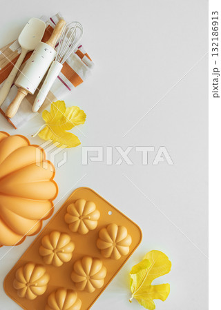 Autumn Baking Setup with Pumpkin Mold, Frosting and Seasonal Decorations Autumn Baking Setup with Pumpkin Mold, Frosting and Seasonal Decorations 132186913