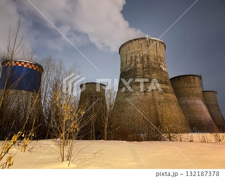 Large power plants with smoke coming out of them. Large power plants with smoke coming out of them. 132187378