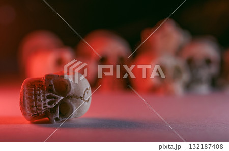 Miniature skulls background. Skull background Miniature skulls background. Skull background 132187408