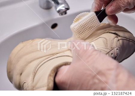 Cleaning Shoes with a Brush and Proper Care Techniques for Enhanced Longevity and Durability 132187424