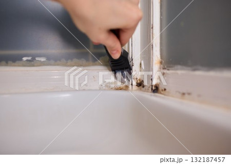 Removing mold from your shower corners is vital for a healthy and clean bathroom 132187457