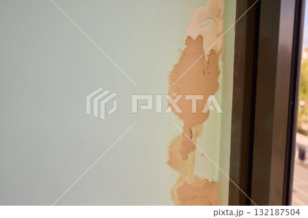 The Wall Repair Process Involves Properly Using Spackling Paste for a Quality Finish 132187504