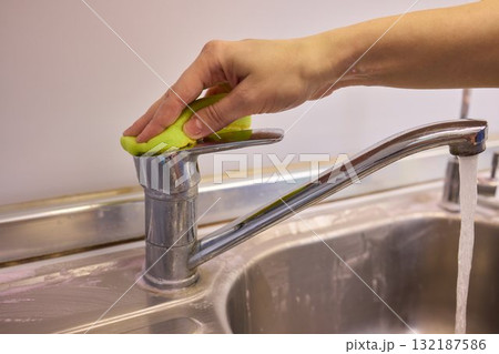 The Thorough Cleaning Process of Faucet Using Appropriate Protective Gloves for Safety The Thorough Cleaning Process of Faucet Using Appropriate Protective Gloves for Safety 132187586