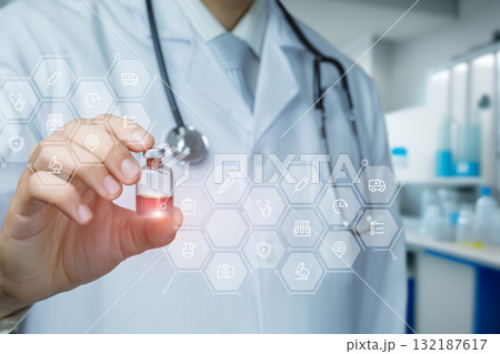 Doctor holding vial with digital health icons in modern lab. 132187617